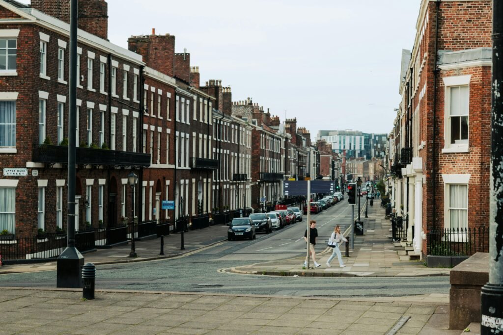 Explore a classic Liverpool street scene featuring historic buildings and everyday life in the city center.